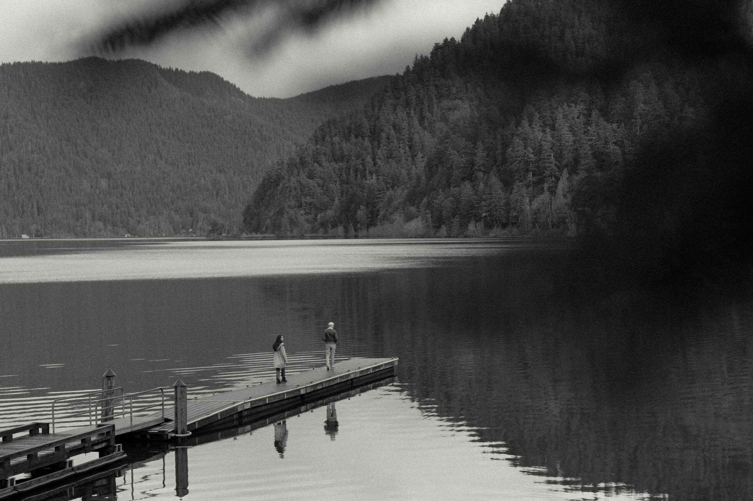 Couple exploring the dock at Lake Crescent in Olympic National Park