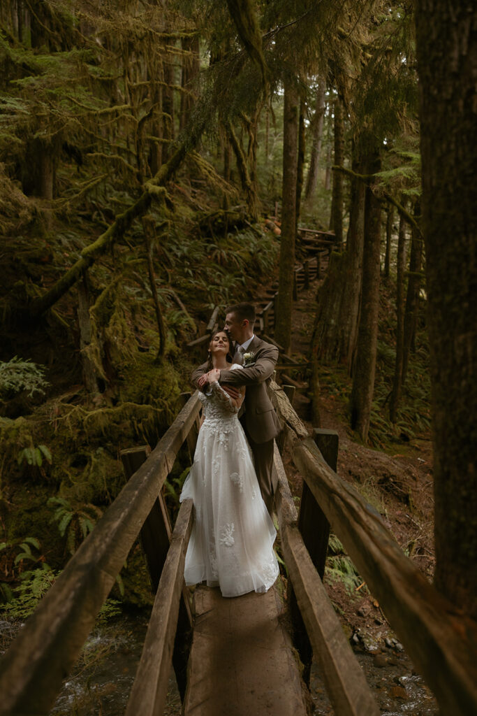 Bridal portraits taken on a hike to Marymere Falls after a Lake Crescent wedding