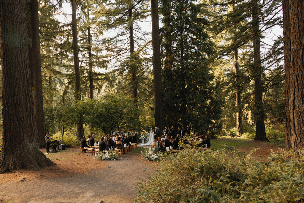Wedding photography in Oregon shows a wedding ceremony amongst the forest in Portland