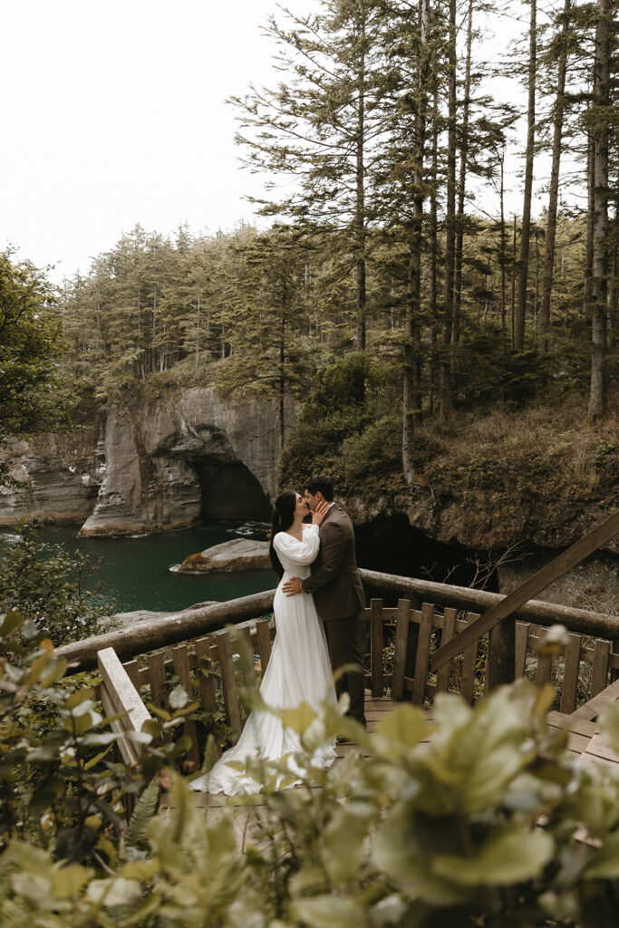 Newlyweds are photographed at Cape Flattery during bridal portraits taken on their Olympic National Park wedding day