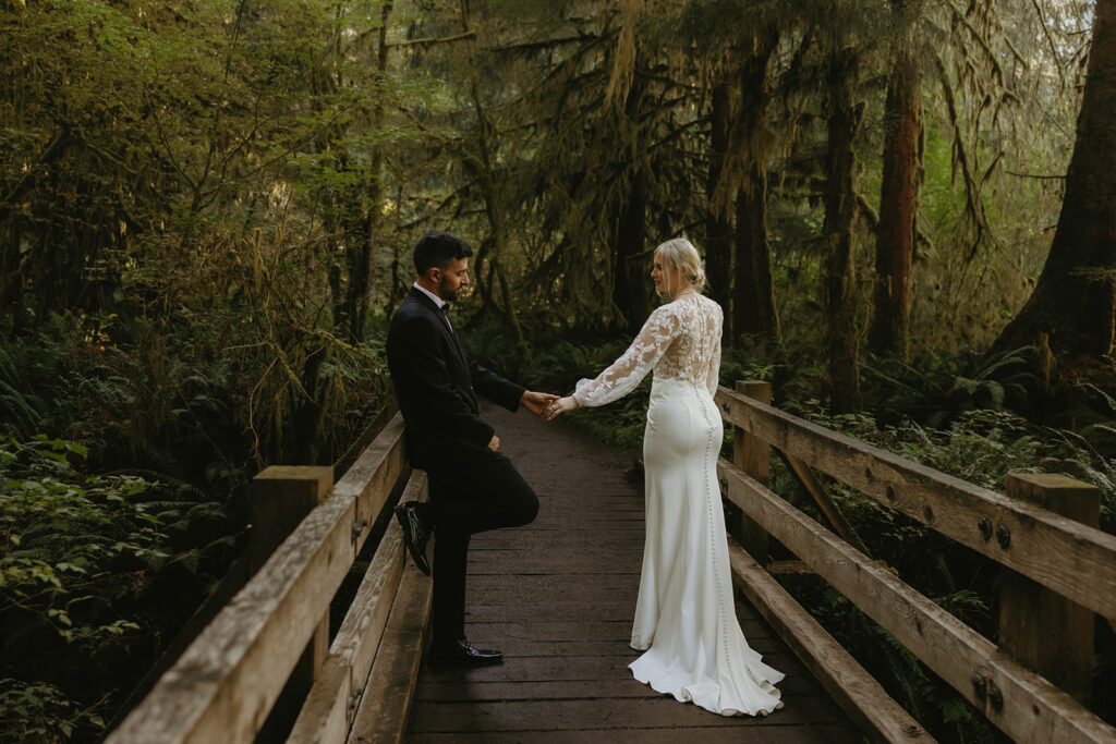 Newlyweds exchange a loving glance in their wedding attire during their national park elopement in the Hoh Rainforest