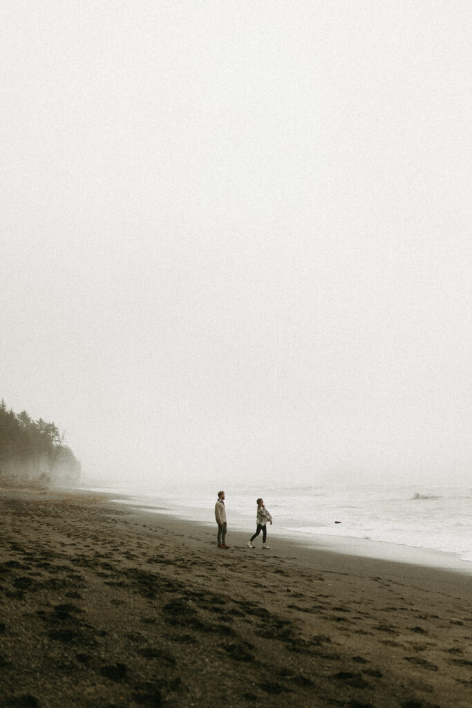 A couple skips rocks at Rialto Beach during their national park elopement