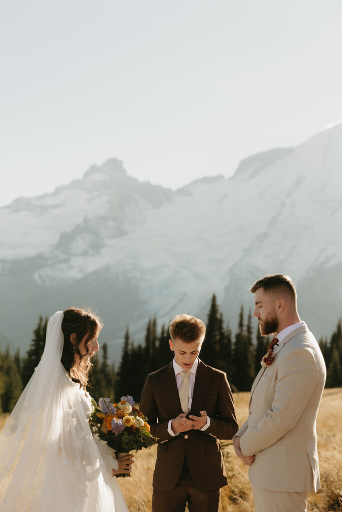 A bride and groom exchange their vows at Sunrise Mt. Rainier National Park as they elope in Washington