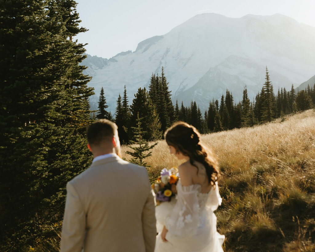 Newlyweds are photographed in their wedding attire after eloping in Washington at Sunrise Mt. Ranieir national park