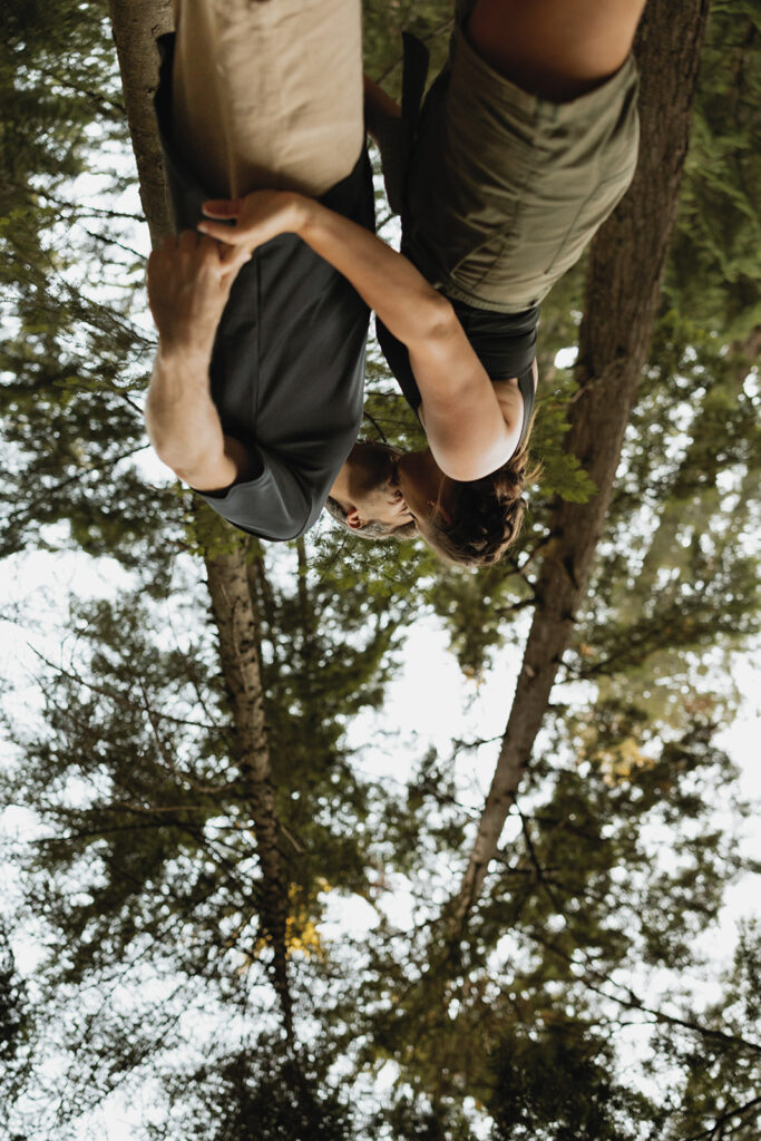An engaged couple share a kiss during an adventure photo session with Seattle engagement photographer, Tessa Marie Collective 