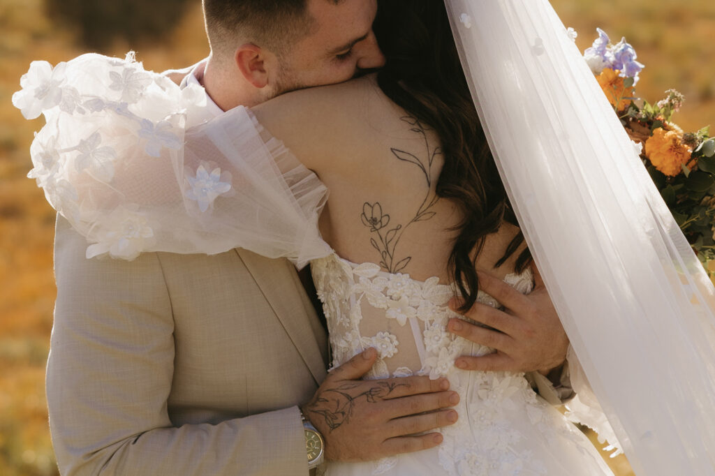 A couple embraces after a first look at their mount rainier elopement