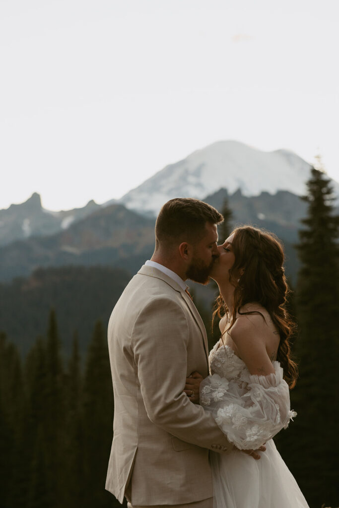 Newlyweds share a kiss at their mount rainier national park elopement