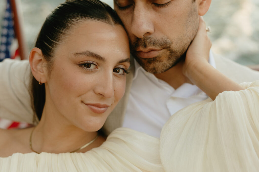 A couple sitting closely together during their engagagement session