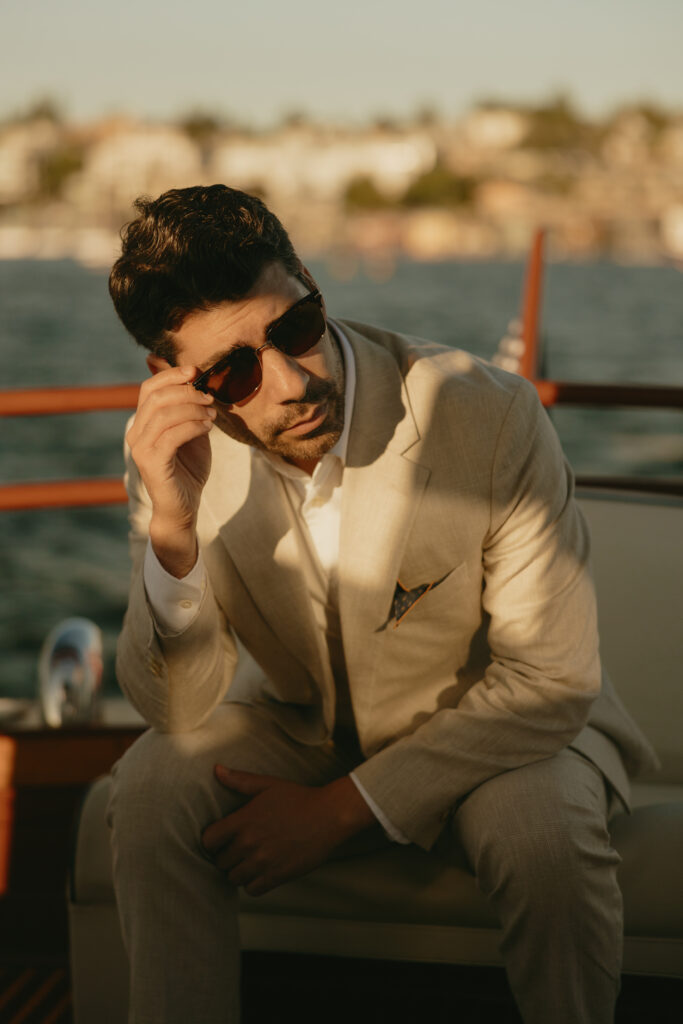 A man touching his sun glasses