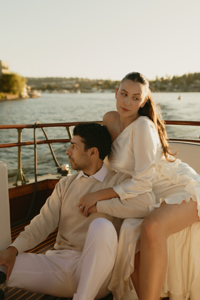 A couple sitting together on a boat in Lake Washington